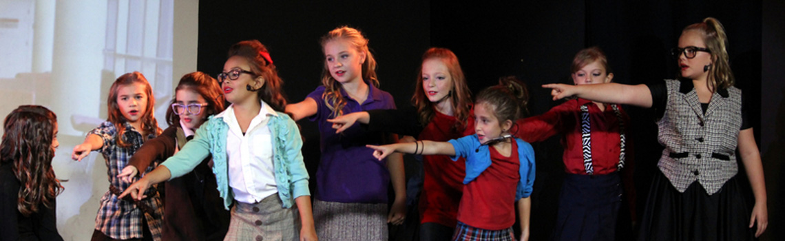 Broadway Kids Academy performers on stage